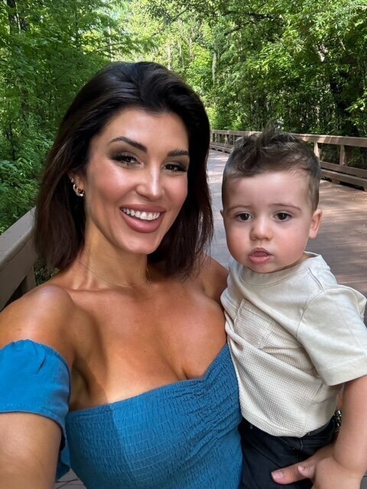 Erica Powell Headshot, holding baby